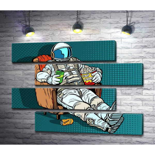 Космонавт розслабляється в кріслі з пивом та попкорном