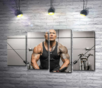 Двейн Джонсон (Dwayne Johnson) тренує м'язи рук в спортзалі