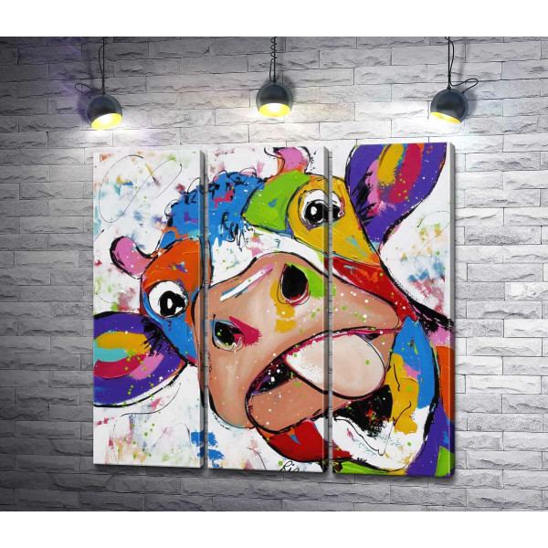 Цветная корова показывает язык