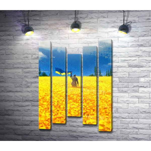 Український воїн із прапором посеред соняшників