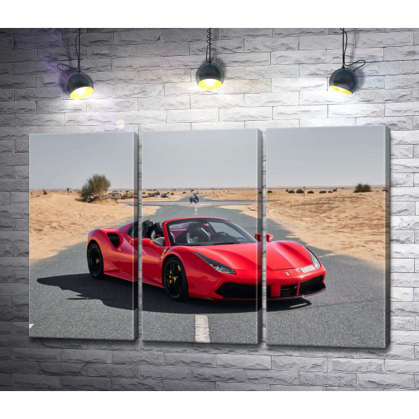 Червоний автомобіль Ferrari 488 Spider на пустельній дорозі