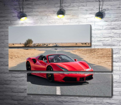Красный автомобиль Ferrari 488 Spider на пустынной дороге