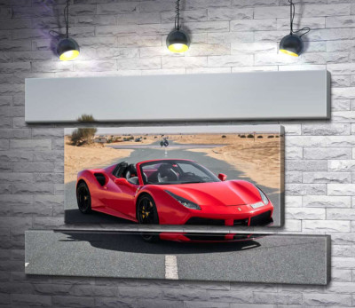 Красный автомобиль Ferrari 488 Spider на пустынной дороге