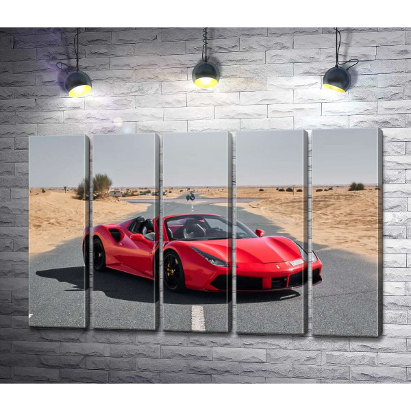 Червоний автомобіль Ferrari 488 Spider на пустельній дорозі