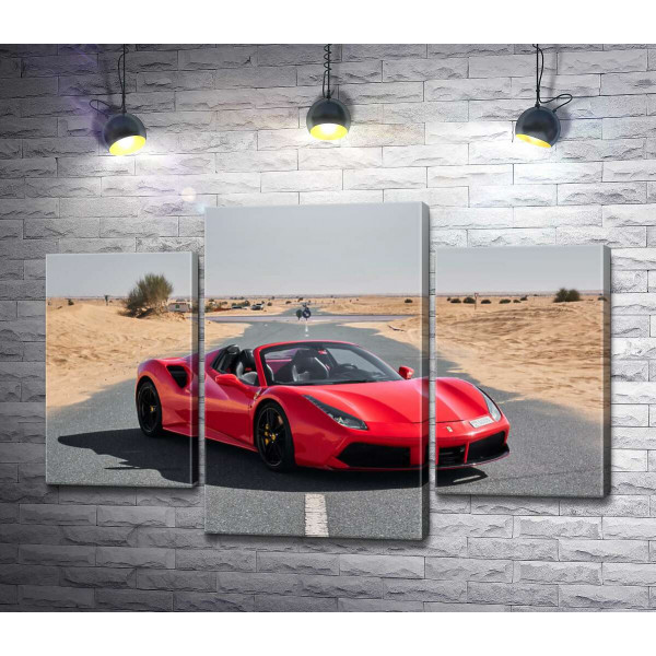 Красный автомобиль Ferrari 488 Spider на пустынной дороге