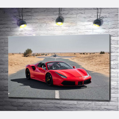 Червоний автомобіль Ferrari 488 Spider на пустельній дорозі