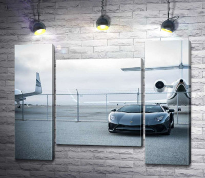 Модульна картина "Чорний автомобіль Lamborghini Aventador на фоні літаків"