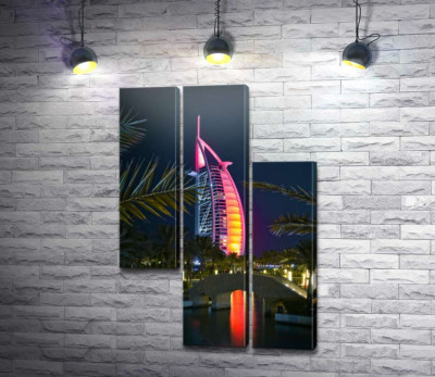 Нічний вид на яскраве вітрило готелю Burj Al Arab