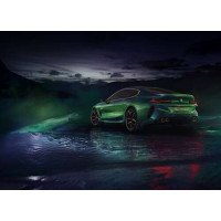Зеленый автомобиль BMW Concept M8 Gran Coupe в дымке