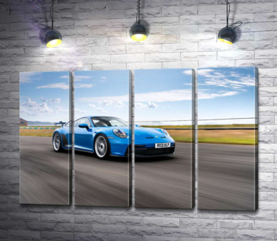 Модульная картина "Голубой автомобиль Porsche 911 GT3 на трассе"
