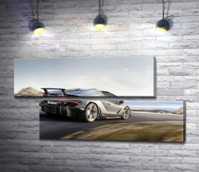 Сріблястий автомобіль Lamborghini Centenario мчить по дорозі