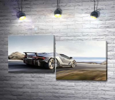 Сріблястий автомобіль Lamborghini Centenario мчить по дорозі