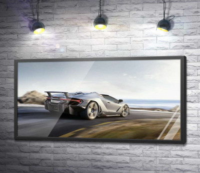 Постер "Сріблястий автомобіль Lamborghini Centenario мчить по дорозі"