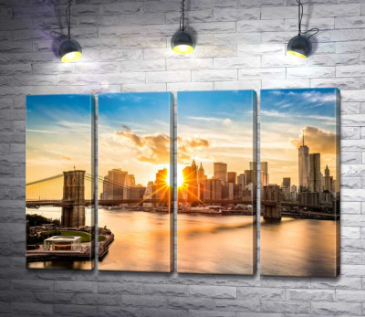 Модульна картина "Промені сонця пробиваються крізь хмарочоси Манхеттена"