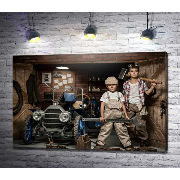 Хлопчаки в ролі автомайстрів у гаражі