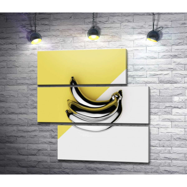 Металлические бананы на желто-белом фоне