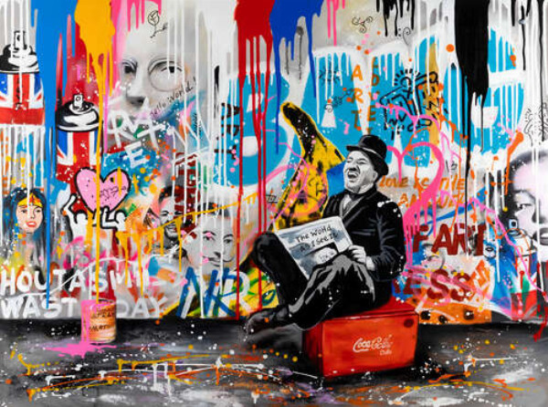 Арт граффити с Чарли Чаплином с газетой