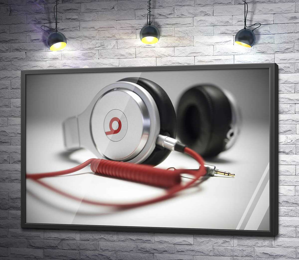 постер Тонкі форми білого корпусу навушників Beats у поєднанні із завитками червоного провода