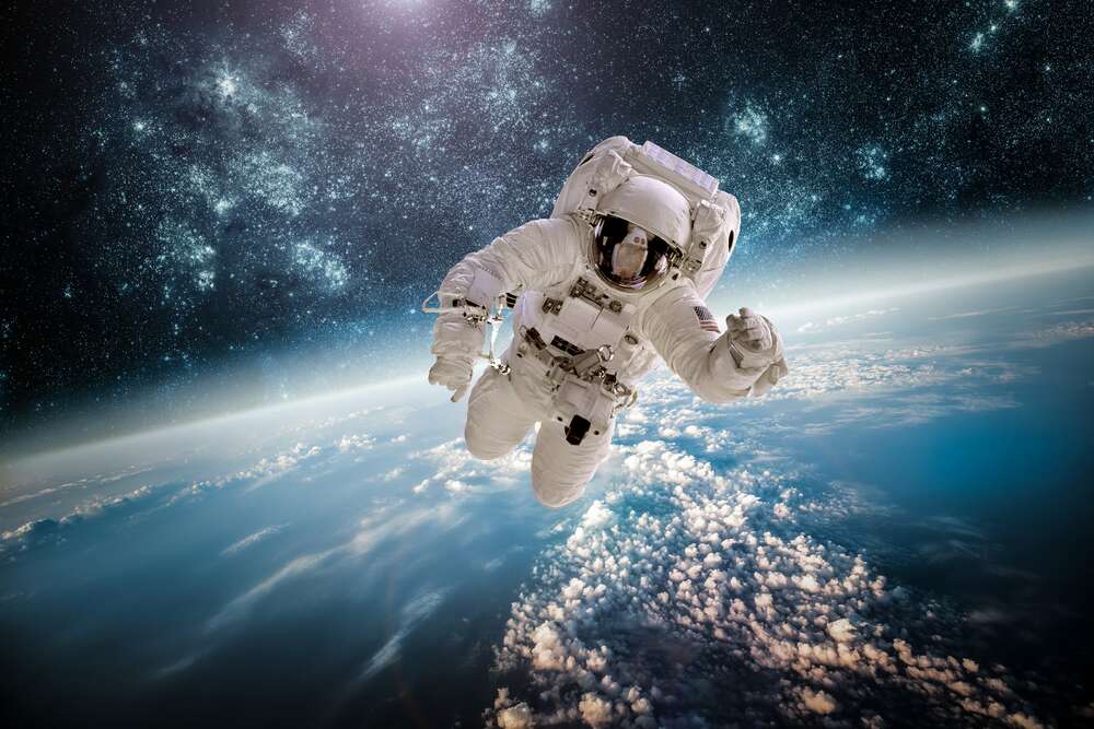 картина-постер Полет космонавта над планетой