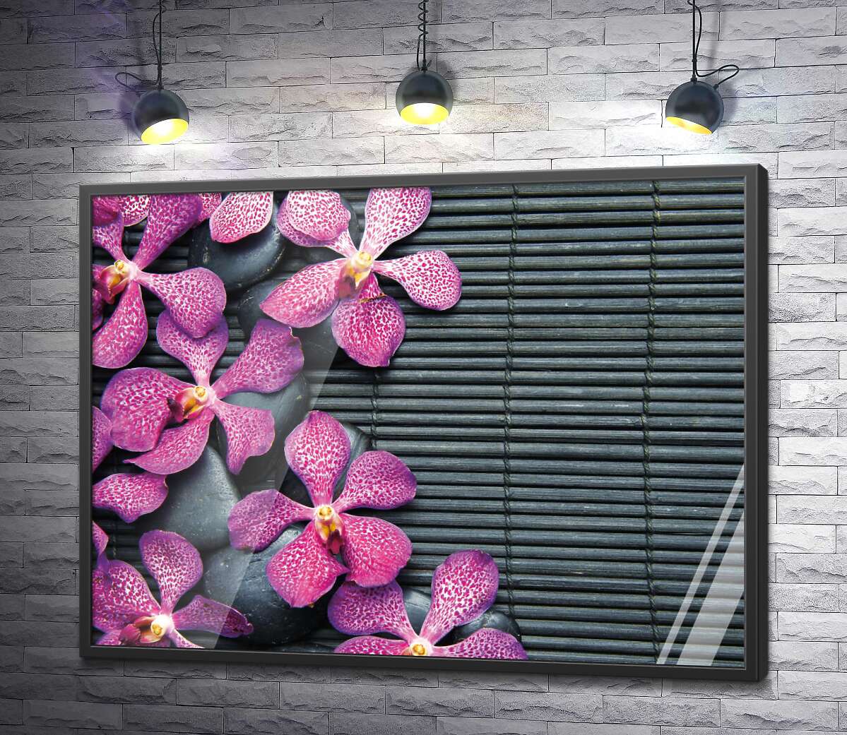 постер Візерунок строкатих орхідей та чорних каменів на бамбуковому килимку