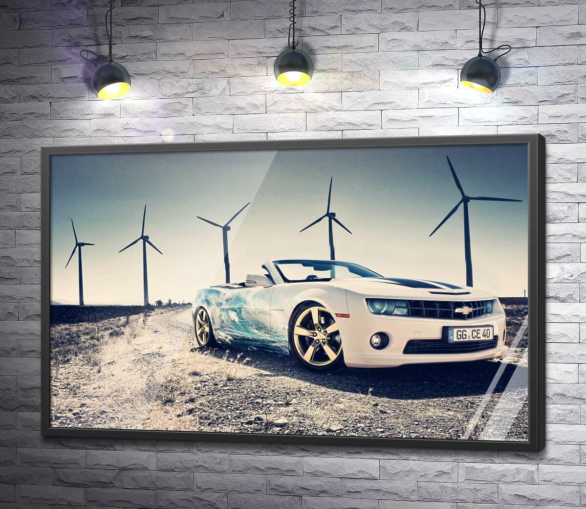 постер Белый автомобиль кабриолет Chevrolet Camaro на фоне ветряных электростанций