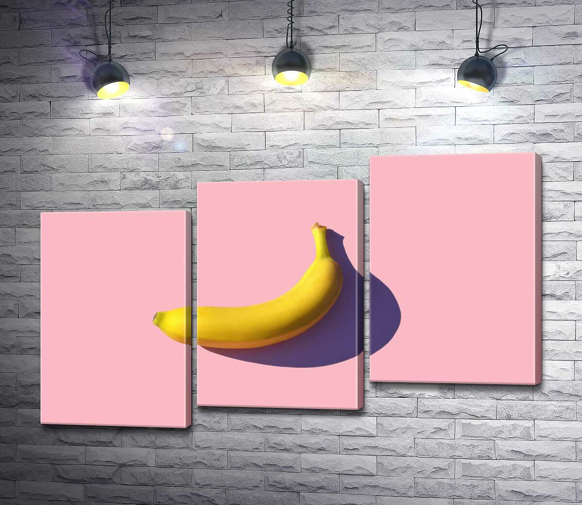 модульна картина Сонячного кольору банан кидає фіолетову тінь на рожевий фон (Модуль №14)