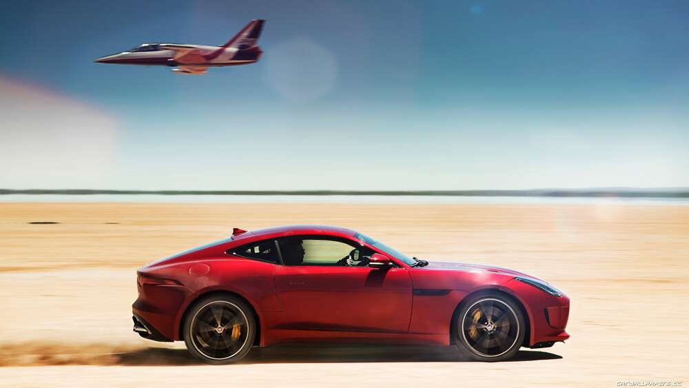 картина-постер Красный автомобиль Jaguar F-Type R разминулся с самолетом среди пустыни