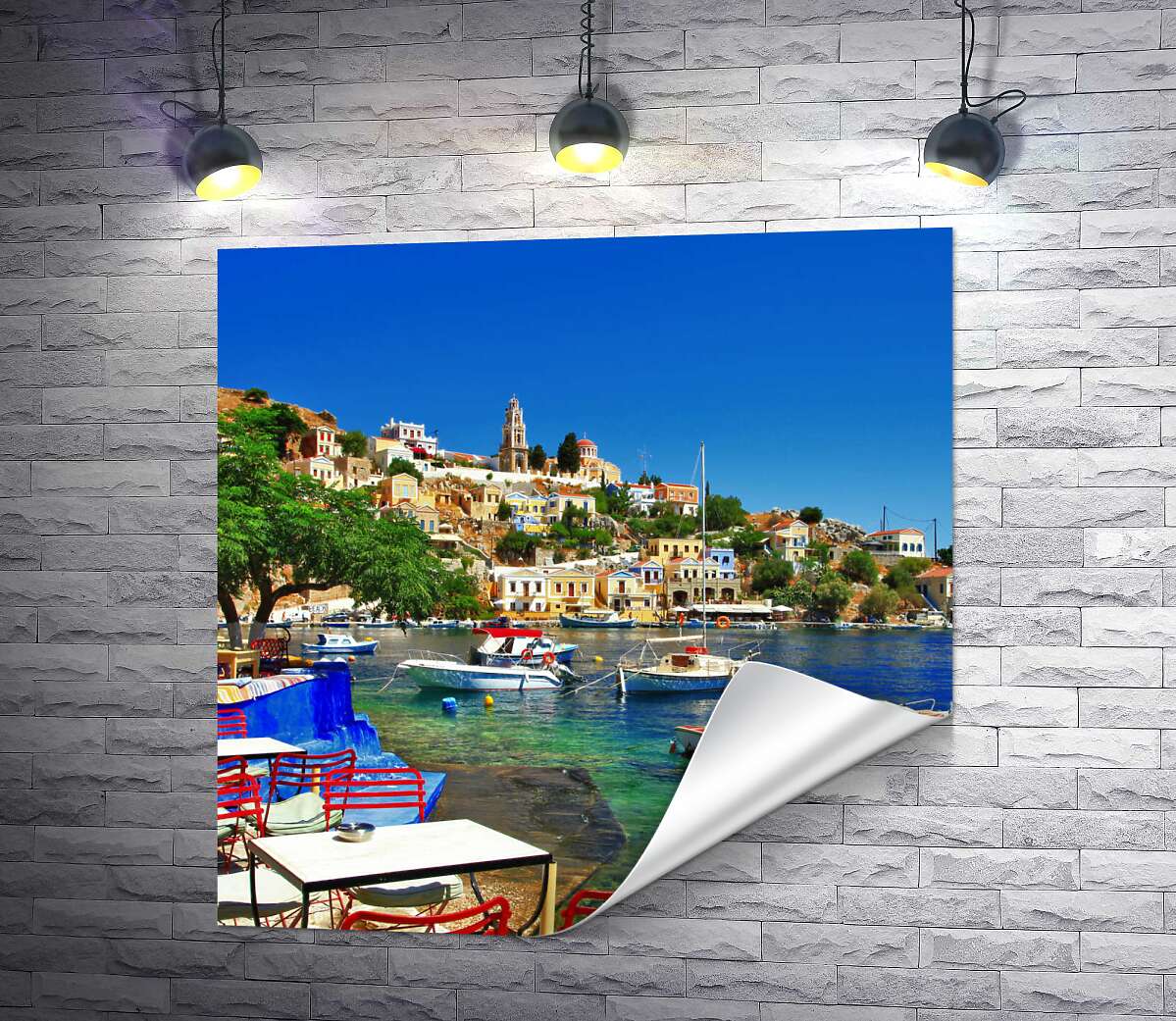друк Літній ресторан на березі моря у грецькому містечку
