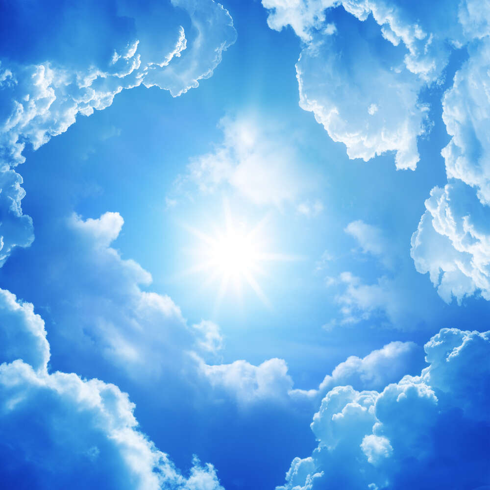 картина-постер Пушистые облака окружили солнце
