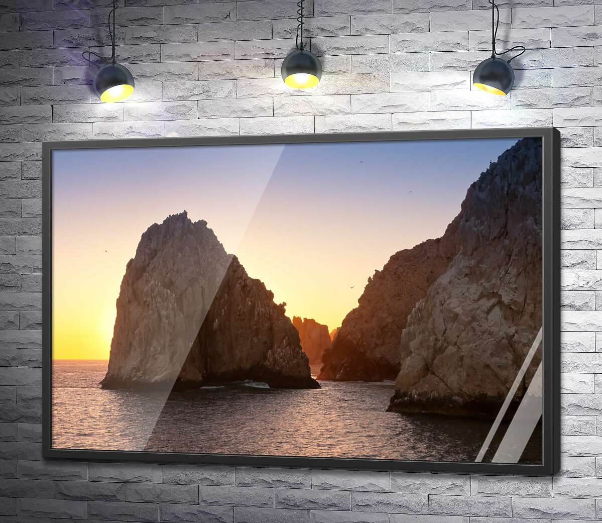 постер Острые пики морских скал в вечерних лучах солнца
