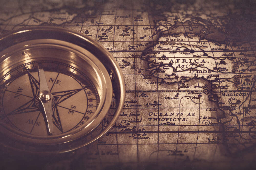картина-постер Пошук правильного шляху з компасом і картою