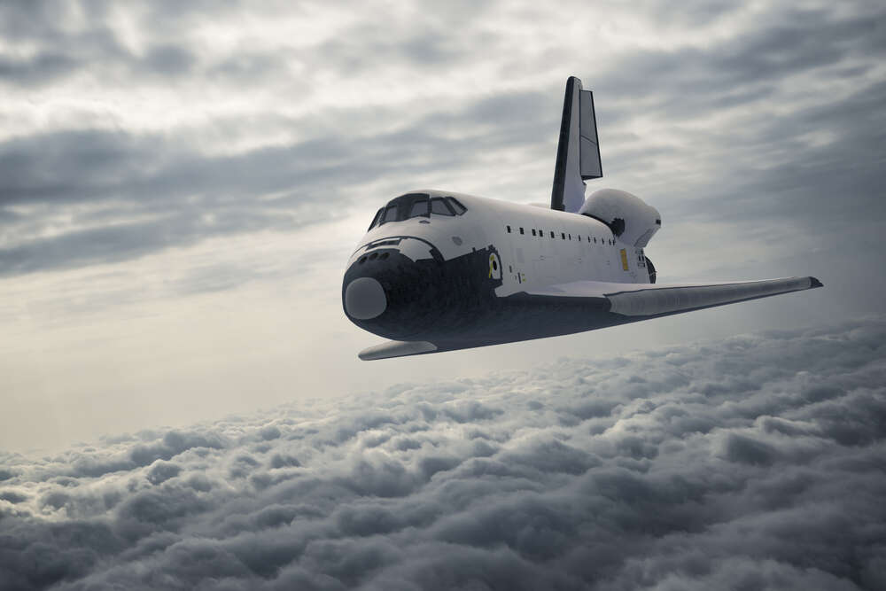 картина-постер Пассажирский самолет в полете над серыми перинами облаков