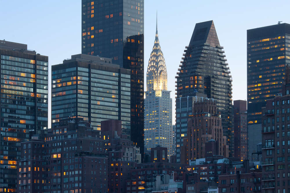 картина-постер Скляні хмарочоси освітлюють вечірній Нью-Йорк